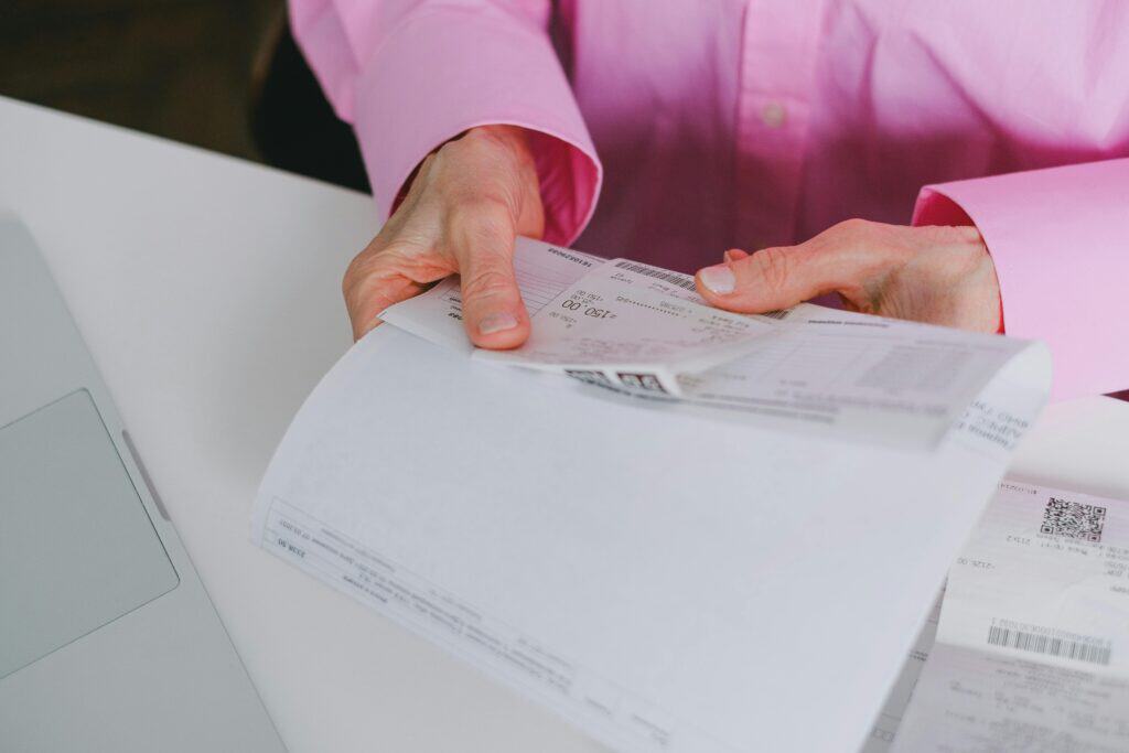 woman holding a receipt with gst tax